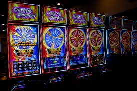 Responsible gaming limits shown with neon win celebration graphics